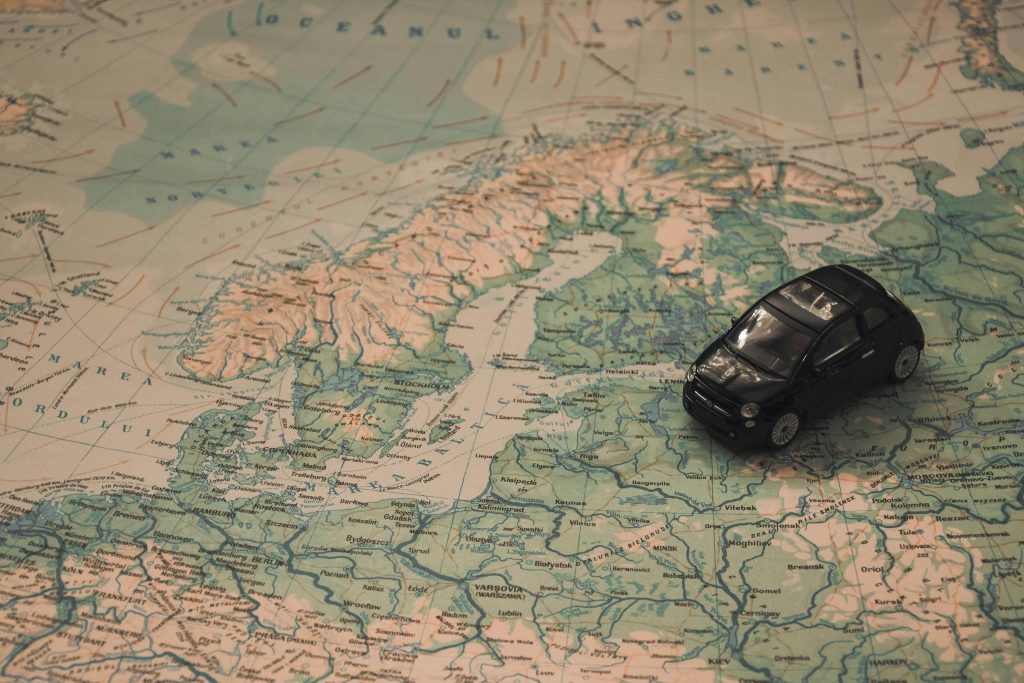 pexels-photo-21014 Black Toy Car on World Map Paper